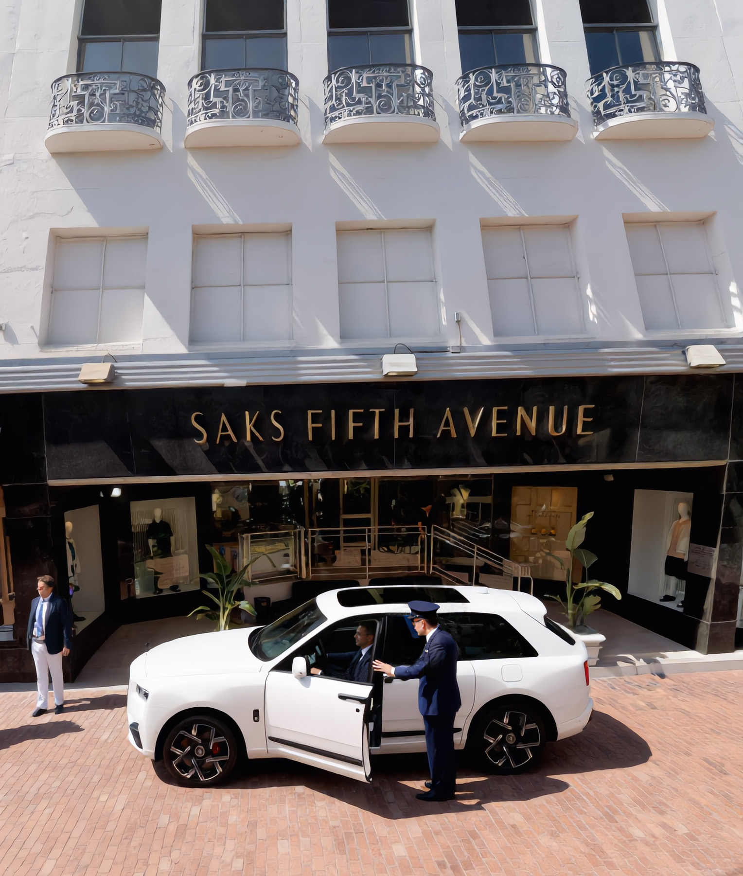 Saks Fifth Avenue Beverly Hills with a classic Jaguar at the entrance